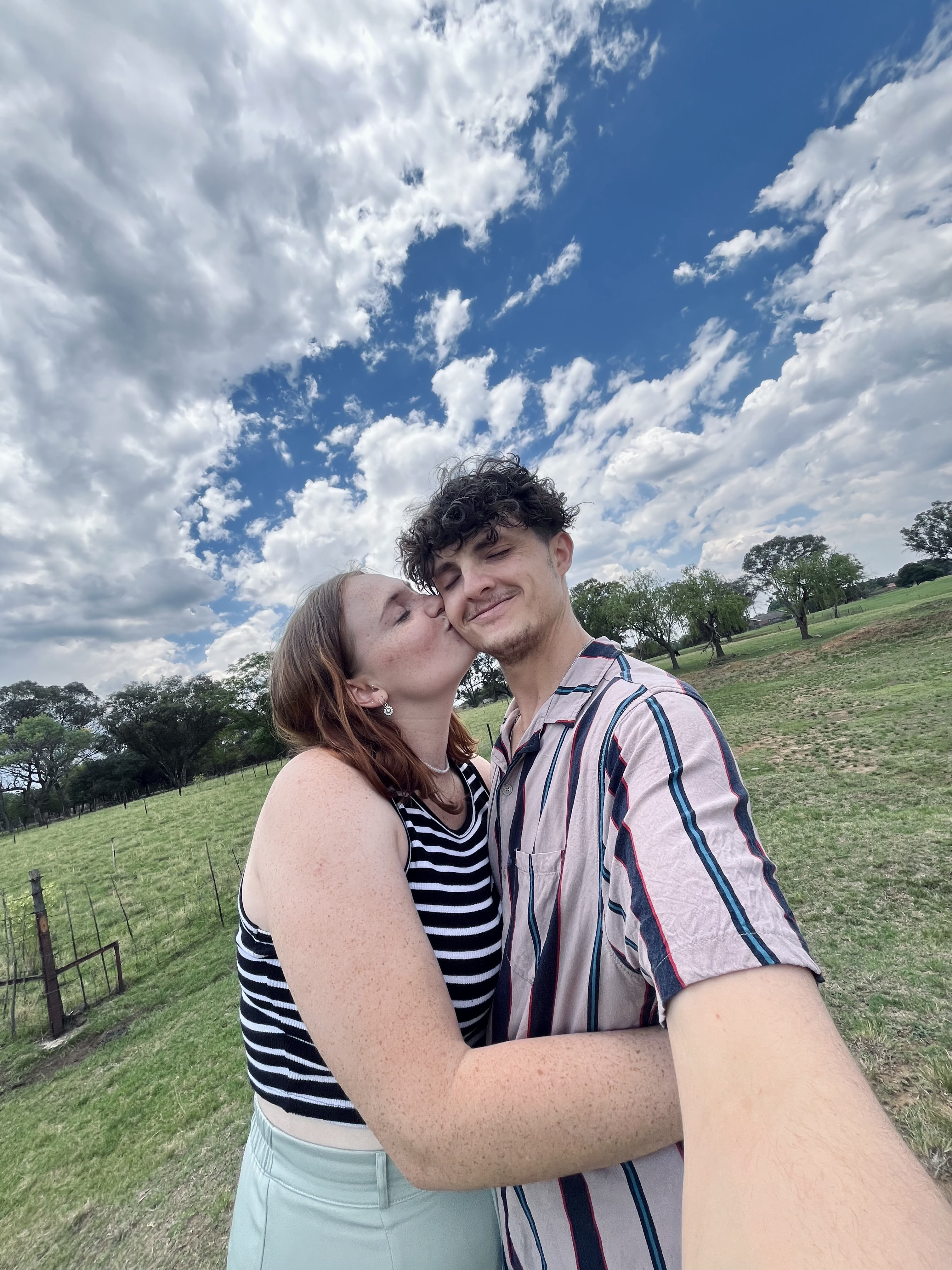 Mitchell tenderly holding Hannah's face