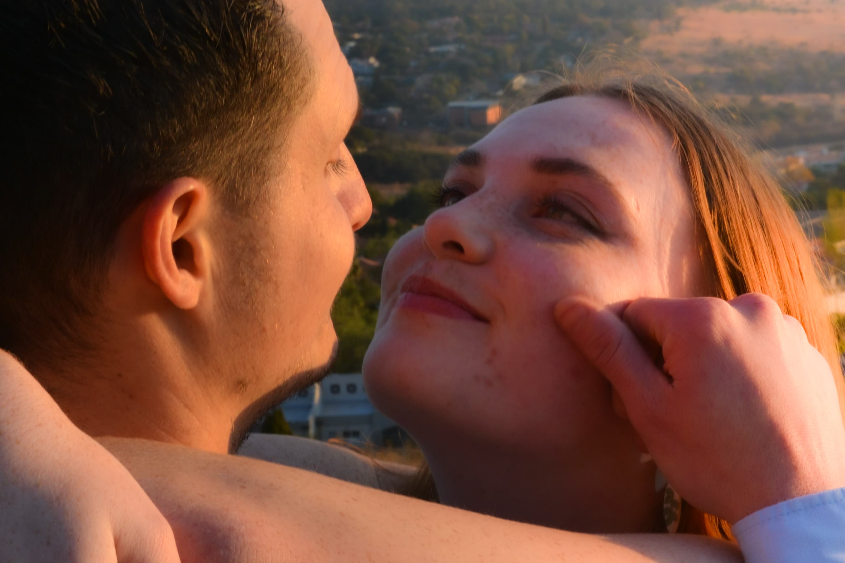 Mitchell holding Hannah's face
