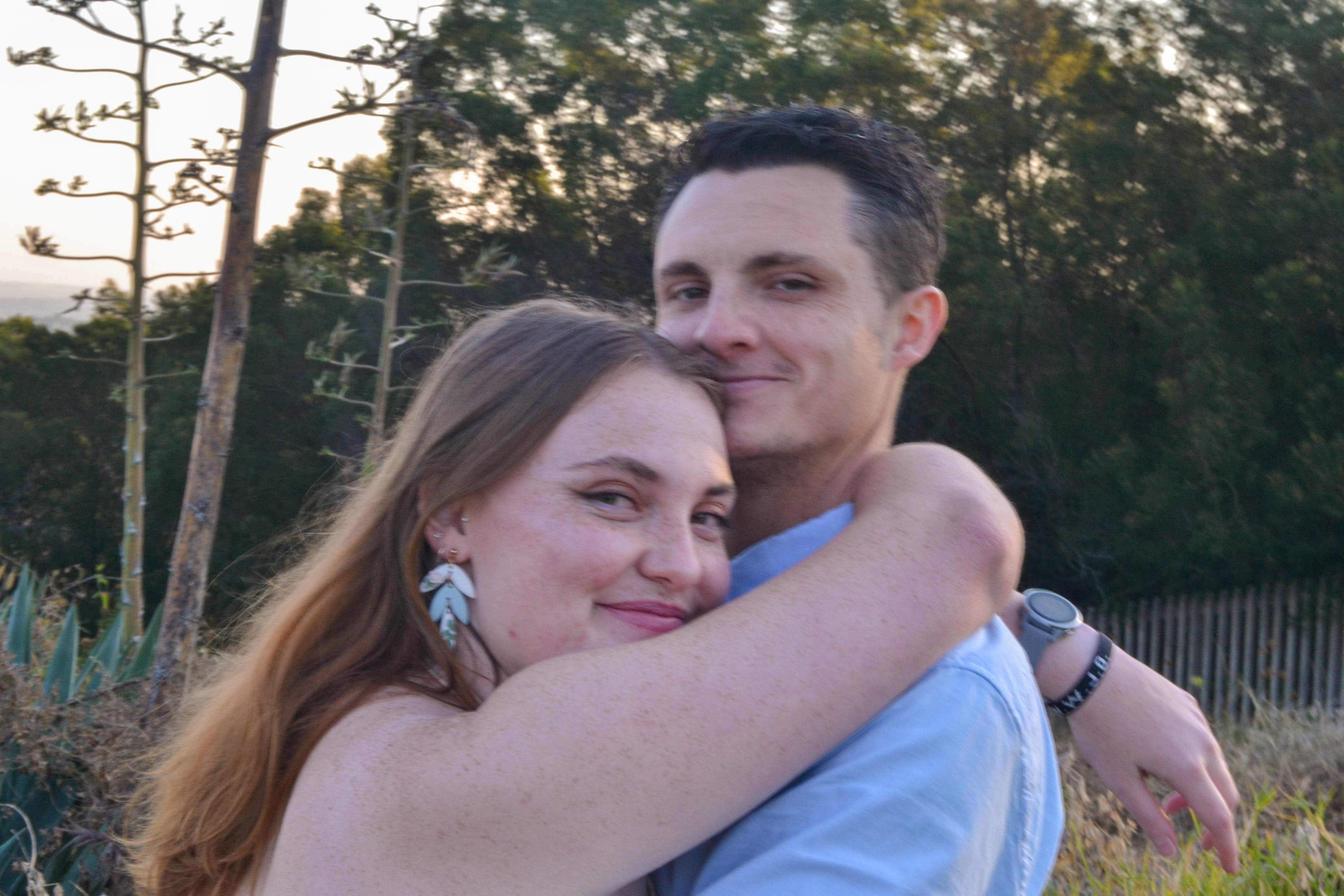 Hannah and Mitchell embracing