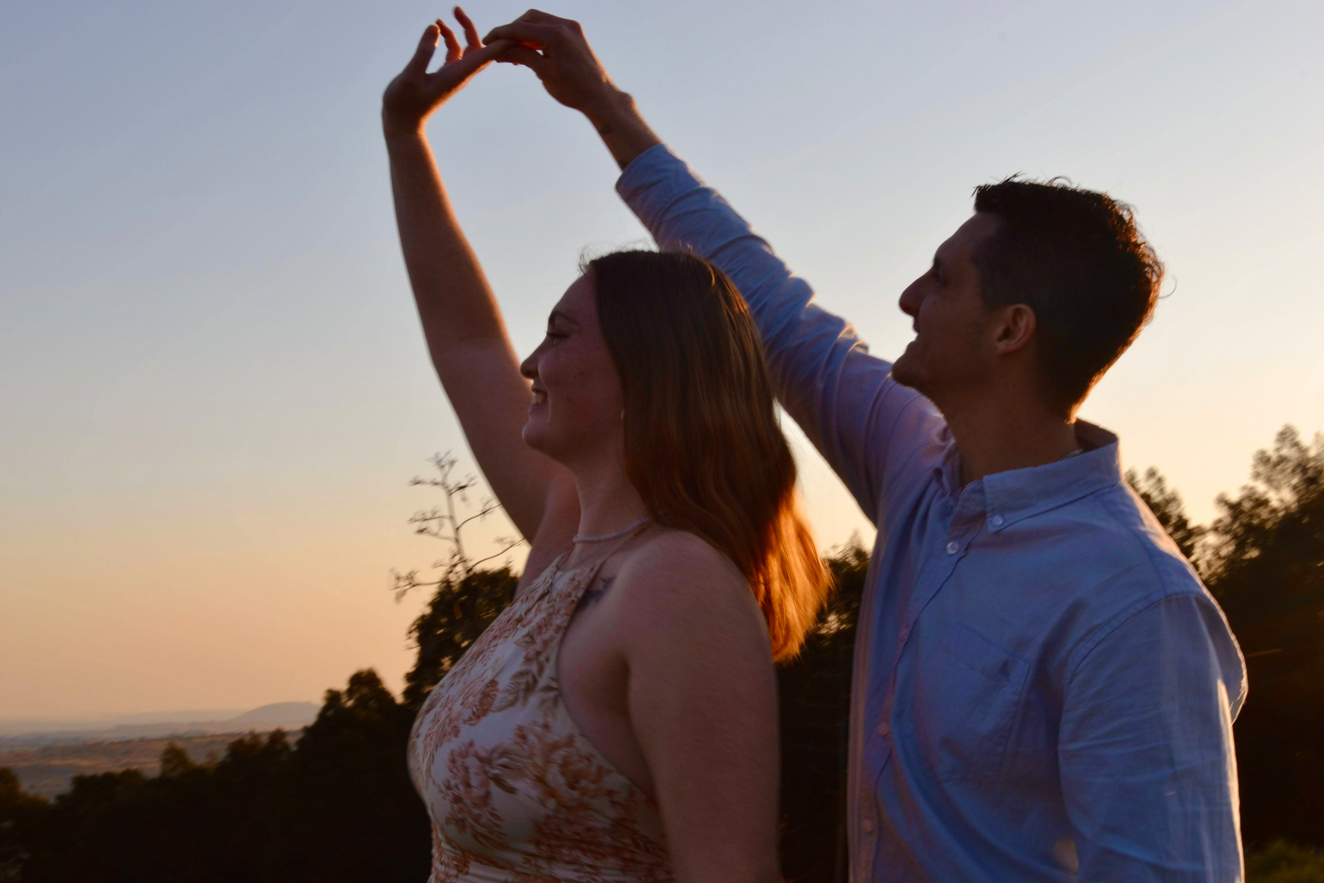 Hannah and Mitchell dancing at sunset